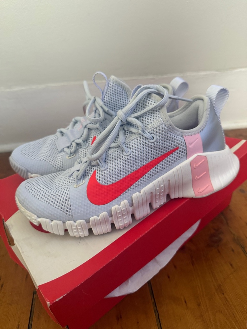 Nike Light Blue Mesh Sneakers with Bright Red Swoosh and Pink Accents